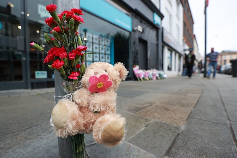 Flowers and tributes at the scene in the High Street area of Carrickfergus in Co Antrim after an eight-year-old girl died and another child was taken to hospital after a serious road collision. Picture by Liam McBurney/PA Wire