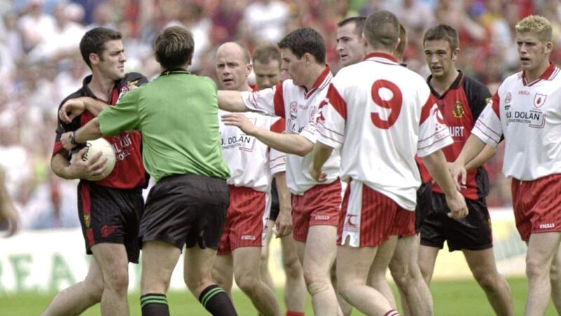Down&#39;s Gregory McCartan seconds before he was sent off by referee Aidan Mangan for throwing the ball at the head of Tyrone&#39;s Brian McGuigan. Picture by Sportsfile 