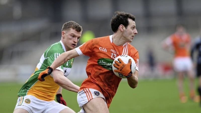 Armagh Ace, Jamie Clarke fends off Sean Pender of Offaly. Picture by Ian Maginess 