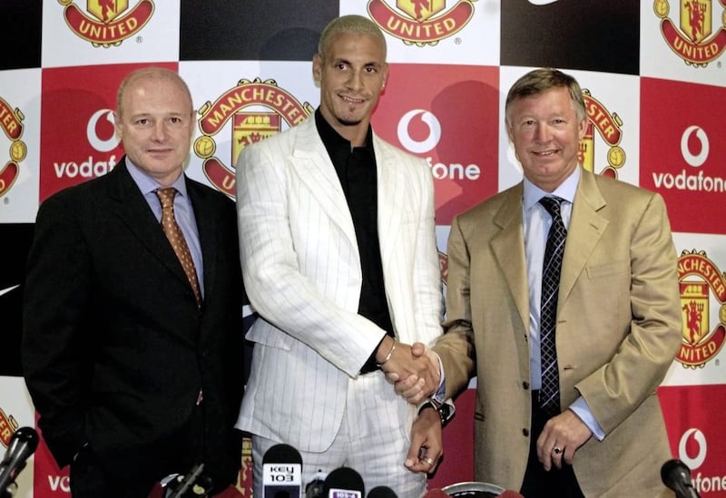 Rio Ferdinand with Alex Ferguson when the player signed for Manchester United in July 2002. 