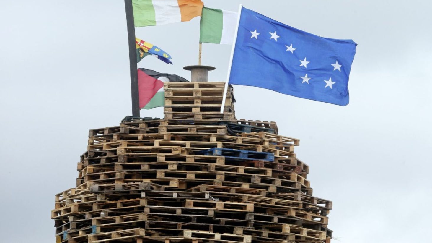 Republican posters and EU flags on a loyalist bonfire in the Shankill area. NO BYLINE. 