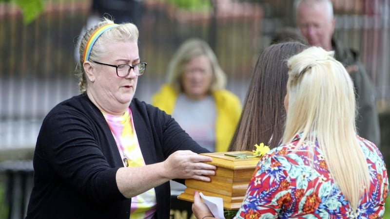 The family of Joleen Corr gathered at her grave in City Cemetery in west Belfast yesterday for a special service. During the gathering, items which had been held back by the authorities as evidence in the murder investigation, including the young woman&#39;s brain and some tissue material, were buried with the 27-year-old. Picture: Mal McCann 