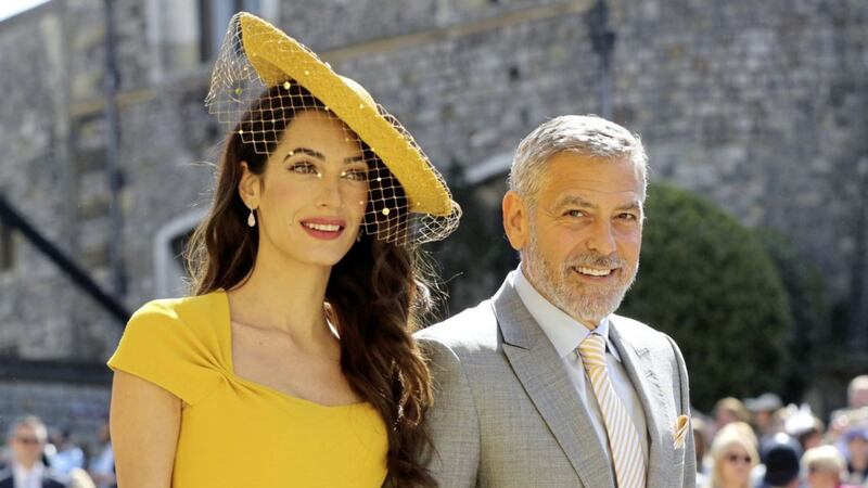 Amal and George Clooney pictured last year at the wedding of Meghan Markle and Prince Harry. Photo: Gareth Fuller/PA Wire 