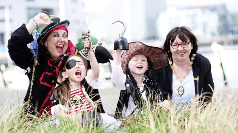 Deputy Lord Mayor Mary-Ellen Campbell launches Belfast&#39;s Titanic Maritime Festival with help from pirates, from left, Christina Nelson, Saskia Harkley and Zach McGrath 