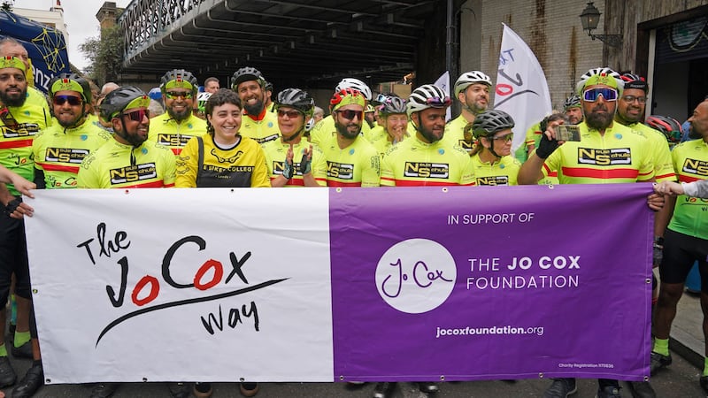 Around 80 cyclists crossed a finish line in London after a 288-mile bike ride in Jo Cox’s memory (Lucy North/PA)