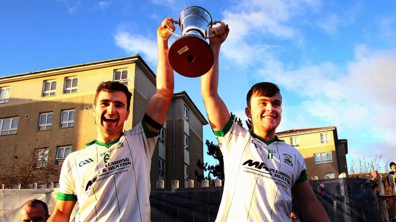 Burren's joint-captains Conor Cox and Darragh Murdock hold aloft the Jimmy McConville Cup after last Sunday's Ulster Club Minor tournament win at St Paul's <br />Picture by S&eacute;amus Loughran&nbsp;