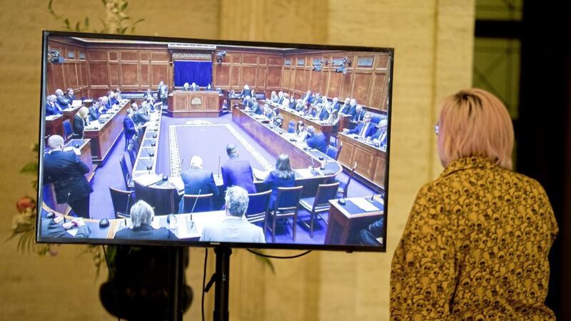 A Stormont official watches proceedings in the assembly chamber on a television in the Great Hall at Stormont Buildings Picture by Liam McBurney/PA 