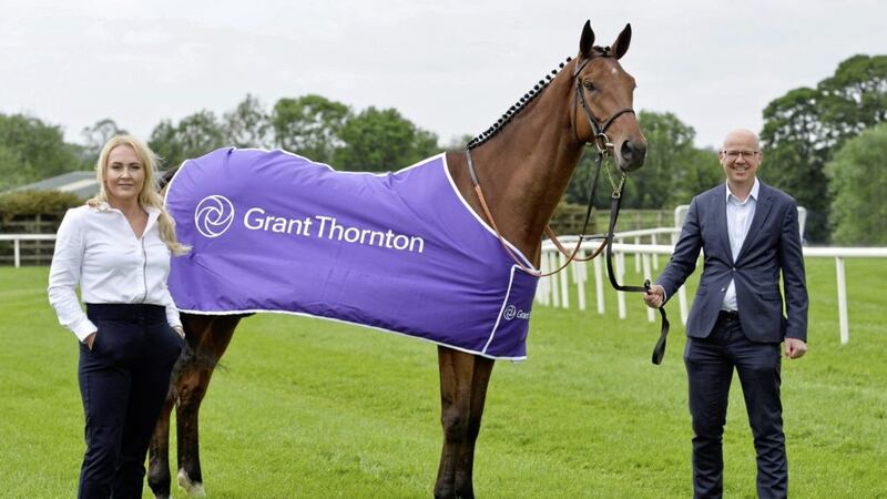 Confirming the Grant Thornton Race Evening on September 3 are the firm&#39;s regional managing director Richard Gillen with Emma Meehan, chief executive of Down Royal Racecourse, alongside four-year- old Ballyhigh owned by Wilson Dennison 