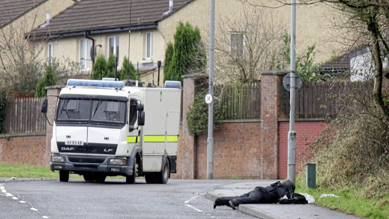 Bomb disposal officers at the scene of the security alert in the Brians Well Road area of west Belfast earlier this month. Picture by Ann McManus 