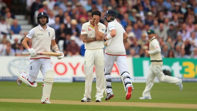Australia's Mitchell Johnson stands dejected as England's Joe Root and Mark Root score runs during day two of the Fourth Investec Ashes Test at Trent Bridge, Nottingham
