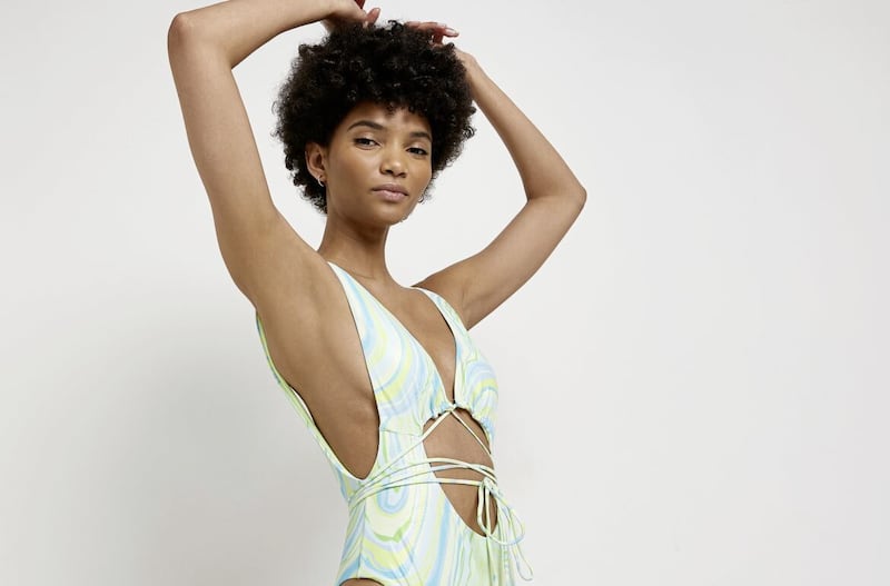 River Island Green Printed Cut Out Plunge Swimsuit, &pound;12 (was &pound;36), available from River Island 
