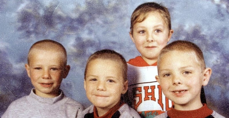 The Quinn brothers Richard (10), Mark (9) and Jason (8), died when a petrol bomb was thrown through the living room window of their home in Carnany estate in Ballymoney, on July 12 1998. Their older brother, Lee, pictured behind, survived as he was staying with his grandparents on the night of the attack