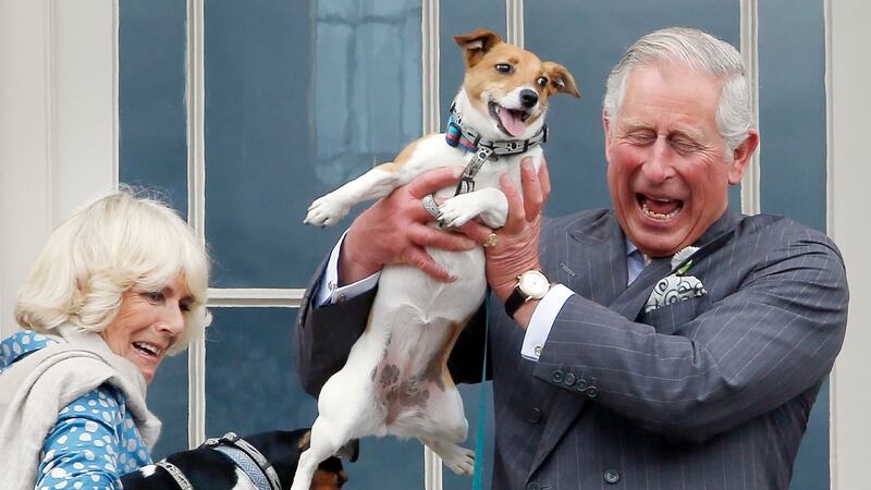Charles and Camilla hold the Camilla’s dogs Beth (left) and Bluebell (right)