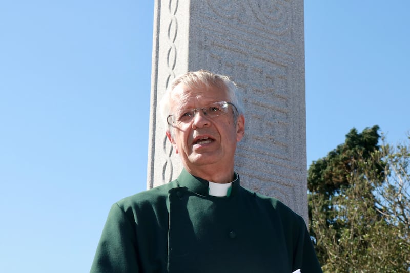 Dean of Down, the Rev Henry Hull, pictured at the cross