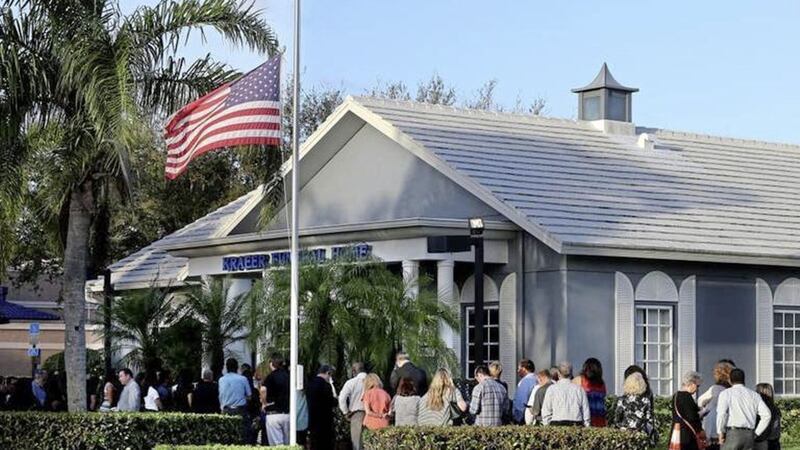 Mourners queue up at Kraeer Funeral Home in Florida to pay their respects to Cara Loughran, a 14-year-old Irish dancer - who has family in Co Antrim - who was killed in a shooting at Marjory Stoneman Douglas High School in Florida 
