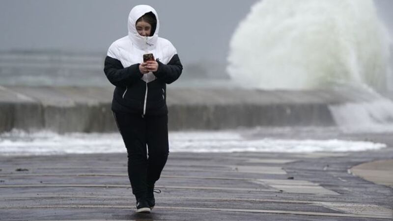 &nbsp;A person makes their way along the sea front in Southsea as Storm Barra hit the UK and Ireland with disruptive winds, heavy rain and snow on Tuesday. Picture date: Tuesday December 7, 2021.