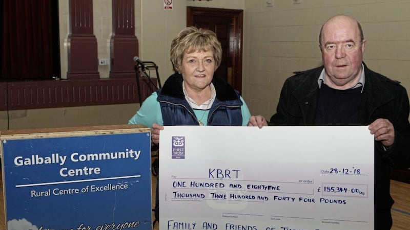 Colin and Eithne Bell with a cheque for their repatriation fund. Picture by Matt Bohill 