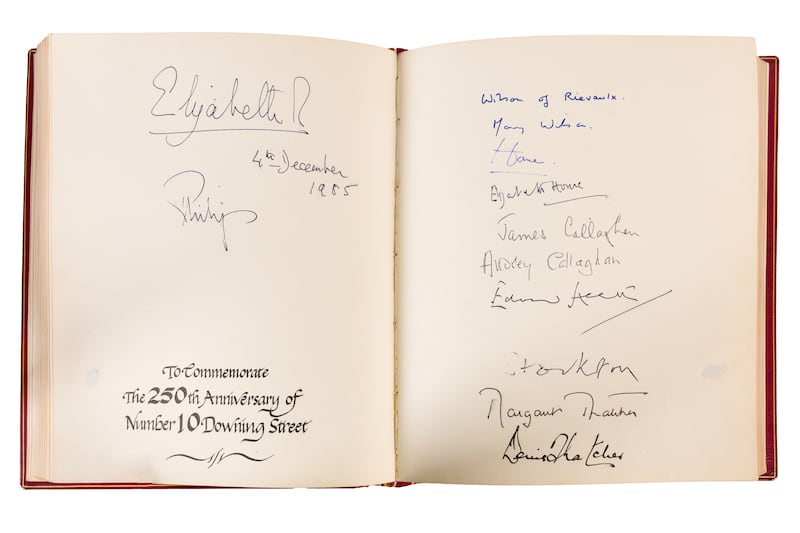 Signatures of the late Queen Elizabeth II and Duke of Edinburgh can be seen in the book