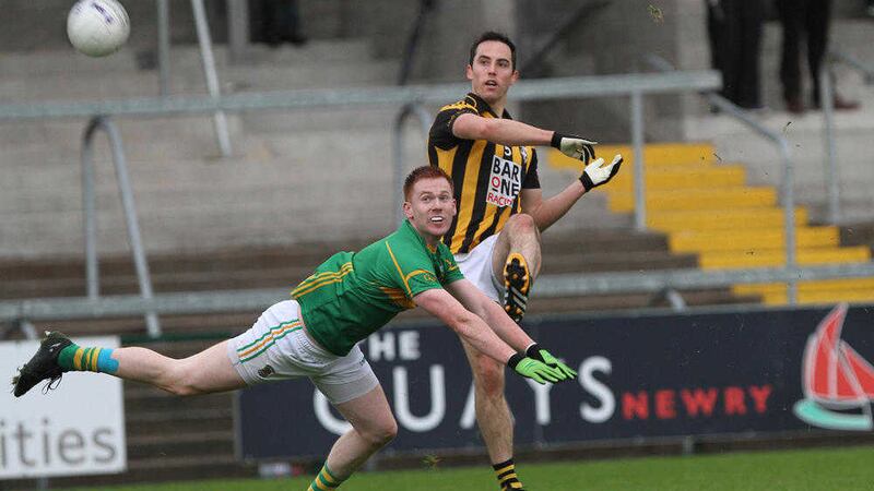 Crossmaglen's Aaron Kernan, pictured in action against Pearse &Oacute;g's Stephen McManus, is an injury doubt for Sunday's county final <br />Picture: Colm O'Reilly