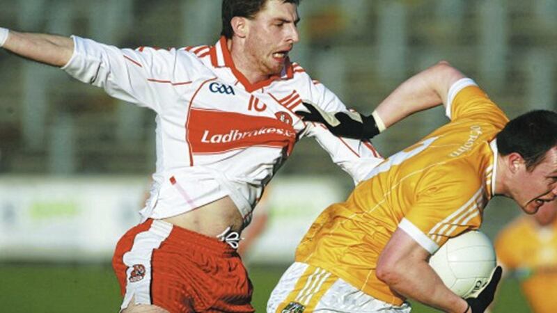 Antrim&rsquo;s Michael McCann gets away from Derry&rsquo;s Gerard O&rsquo;Kane at Casement Park, Belfast. Picture: Seamus Loughran 