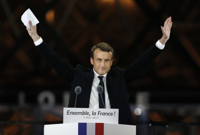 French President-elect Emmanuel Macron gestures during a victory celebration outside the Louvre museum in Paris, France, Sunday, May 7, 2017. 