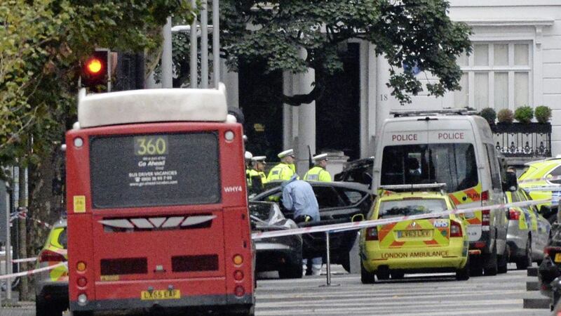 A forensic officer examines a car at the scene on Exhibition Road in London, as several people have been injured after a car ploughed into people outside the Natural History Museum on Saturday PICTURE: John Stillwell/PA 