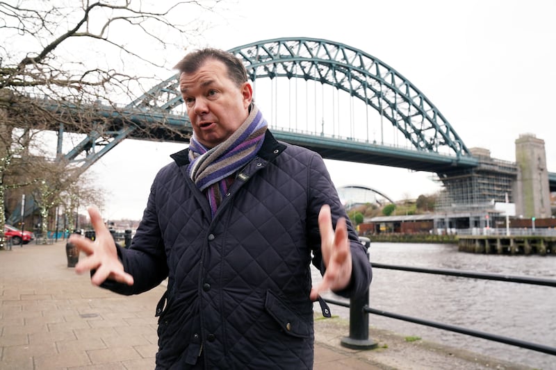 Roads Minister Guy Opperman speaks to the media in front of the Tyne Bridge