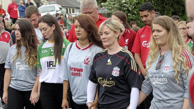Karl Heaney&#39;s mother Monica Heaney (in black Liverpool shirt), his sisters and girlfriend Ciara attending his funeral at St Mary&#39;s Church, Newry. Picture by Cliff Donaldson 