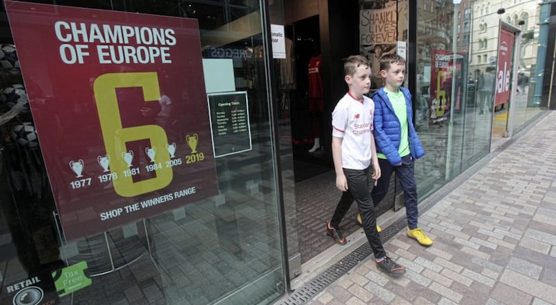 Liverpool fans leaving the store in Belfast yesterday. Picture by Ann McManus 
