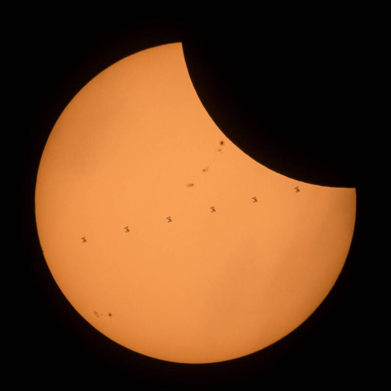 The International Space Station seen as well as the partial eclipse in the US in 2017 (Joel Kowsky/AP)