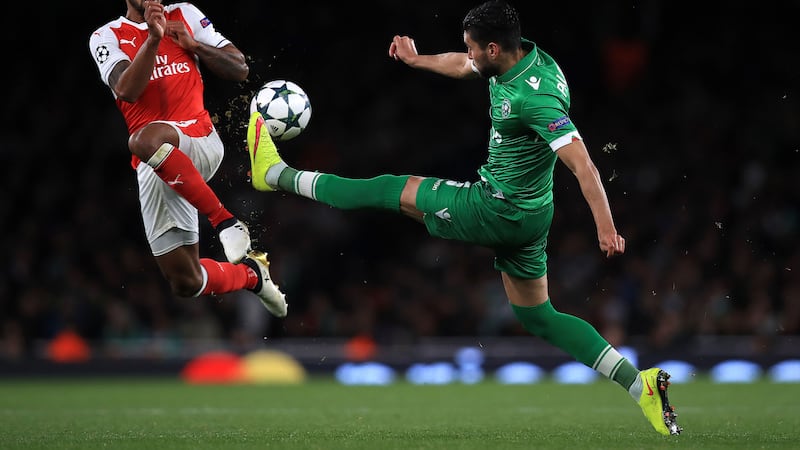 Arsenal's Theo Walcott (left) and Ludogorets' Jose Palomino battle for the ball during the UEFA Champions League match at the Emirates Stadium, London&nbsp;