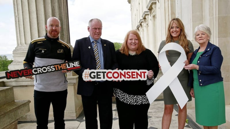 Tahnee McCorry, CEO, White Ribbon NI, second from right, with, (L-R): Ronan McCarthy, Provincial Administrator, Ulster Ladies Gaelic; Brian McAvoy, CEO/Provincial Secretary, Ulster GAA; Naomi Long, Allian Party leader; and Deirdre McGrath, Ulster Camogie. 