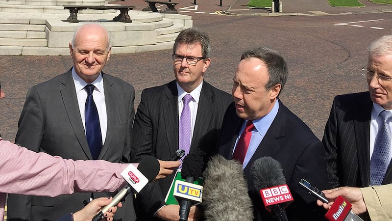 DUP deputy leader Nigel Dodds centre flanked by senior DUP member William McCrea (left), and MPs Jeffrey Donaldson (second left) and Gregory Campbell (right) outside Stormont House, Belfast, after meeting with Secretary of State Theresa Villiers