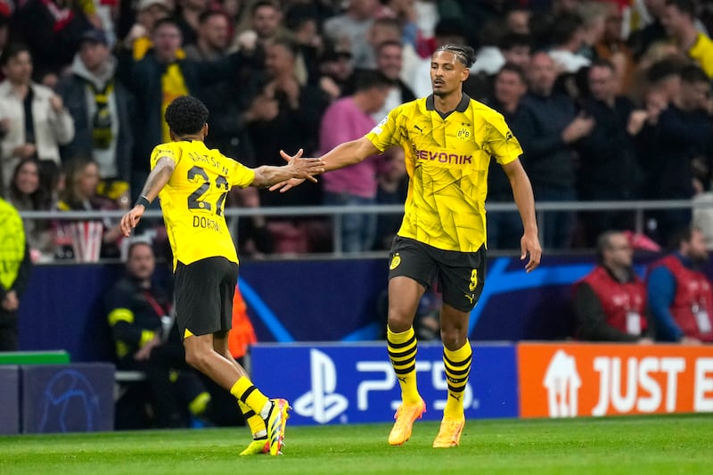 Sebastien Haller, right, got Borussia Dortmund back in the tie (Manu Fernandez/AP)