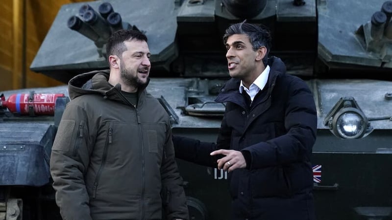 Prime Minister Rishi Sunak and Ukrainian President Volodymyr Zelensky meet Ukrainian troops being trained to command Challenger 2 tanks at a military facility in Lulworth, Dorset (Andrew Matthews/PA)