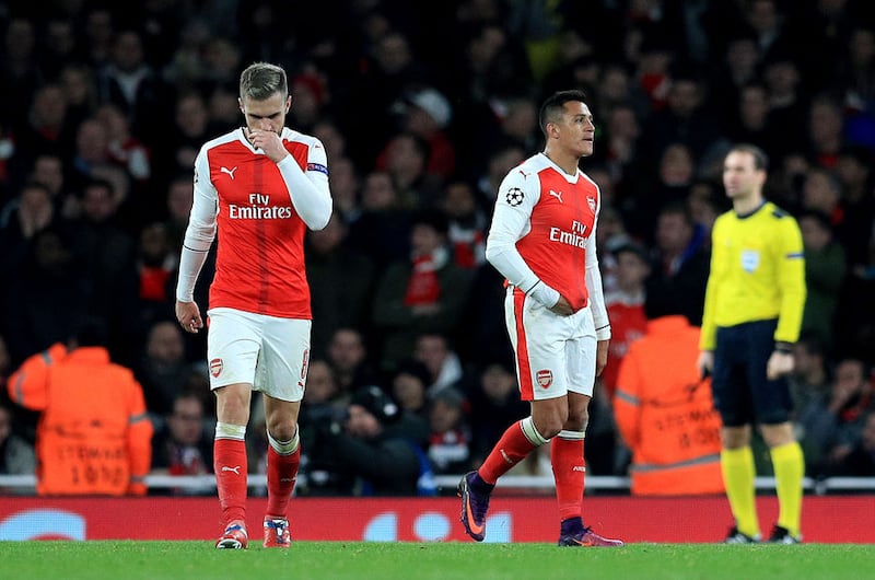 Arsenal's Aaron Ramsey (left) and Alexis Sanchez (right) appear dejected during the UEFA Champions League match at the Emirates Stadium