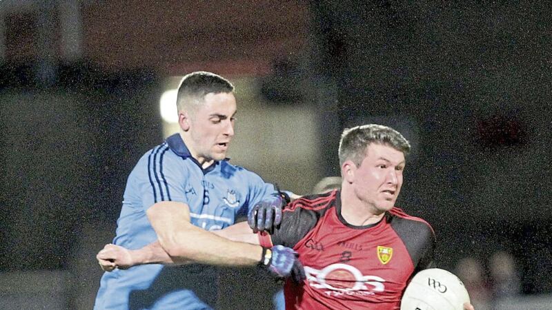 Down&#39;s Peter Turley holds off Dublin&#39;s James McCarthy in the Allianz Football League at Pairc Esler last year. Picture Colm O&#39;Reilly 