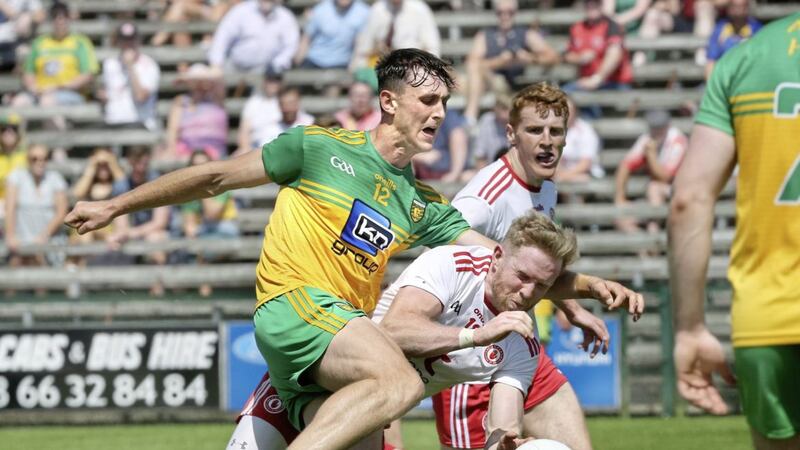Donegal&#39;s Michael Langan is taken down by Frank Burns&#39;s challenge. Picture Margaret McLaughlin 