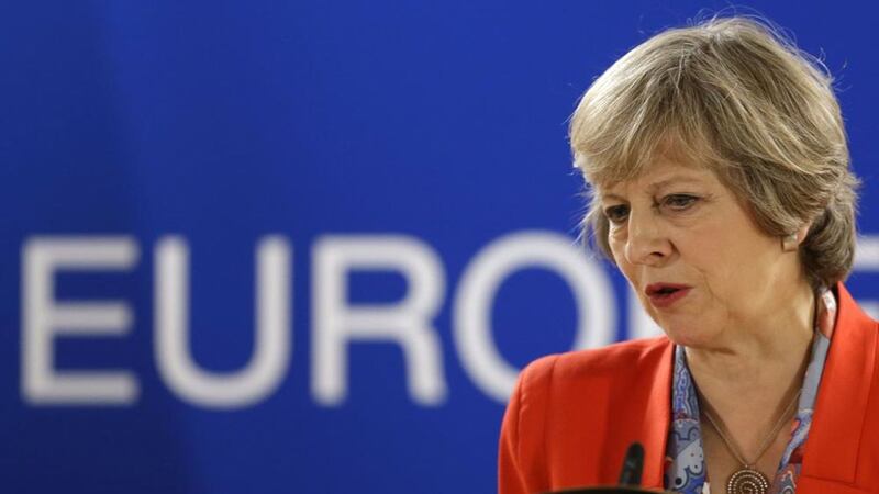 Theresa May answers a question during the final press briefing at the EU Summit in Brussels 