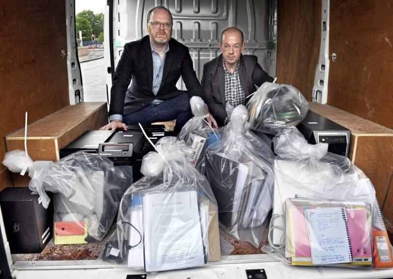 Trevor Birney and Barry McCaffrey at Castlereagh Police Station in east Belfast after having materials and computers seized by the PSNI returned to them. 