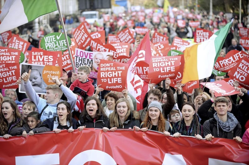 Anti-abortion protesters march through Dublin to campaign for the retention of the Eighth Amendment