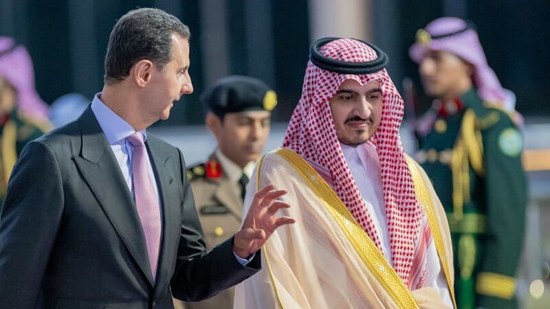 Syrian President Bashar Assad, is accompanied by Prince Badr Bin Sultan, deputy governor of Mecca, upon his arrival at Jeddah airport (Saudi Press Agency via AP)