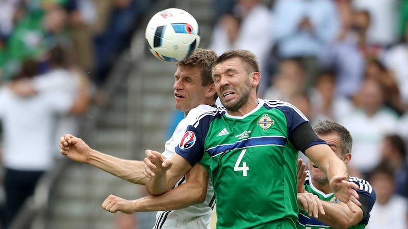 &nbsp;Northern Ireland&rsquo;s Gareth McAuley contests a header with Germany&rsquo;s Thomas Muller.&nbsp;Picture by PA