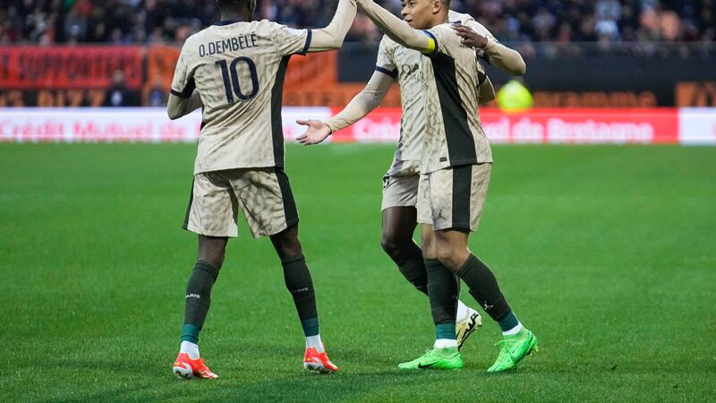 Kylian Mbappe (right) and Ousmane Dembele celebrate during Paris St Germain’s win over Lorient (Michel Euler/AP)