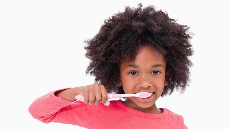 Children who keep up a good oral hygiene routine can help fight back against their genetic predisposition 