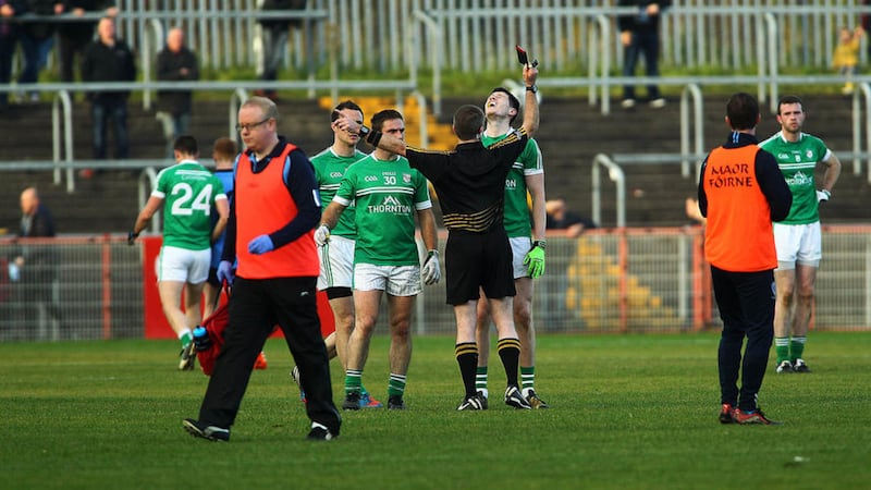 Cargin's John Carron is shown a black card by referee P&aacute;draig Hughes in last Sunday's Ulster quarter-final