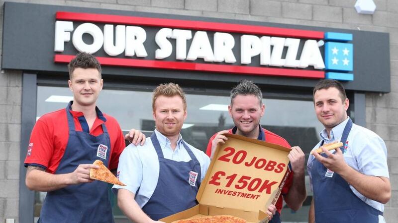 Darren Colgan (second left) is joined by some of his team to celebrate the opening of the new Four Star Pizza Bangor store 