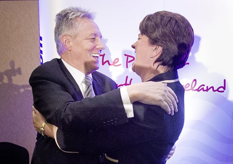 Peter Robinson embraces Arlene Foster after she was formally elected as leader of the DUP in December 2015. Picture by Liam McBurney, Press Association 