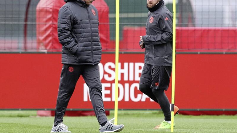 Manchester United manager Jose Mourinho (left) and Wayne Rooney during a training session at the Aon Training Complex, Carrington