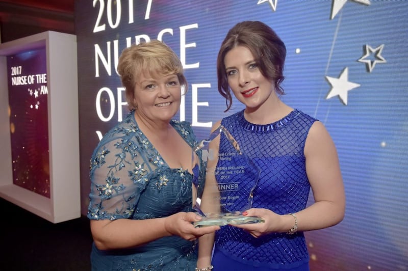 Janice Smyth (left), director of the Royal College of Nursing, presents Siobhan Rogan with her Nurse of The Year award 